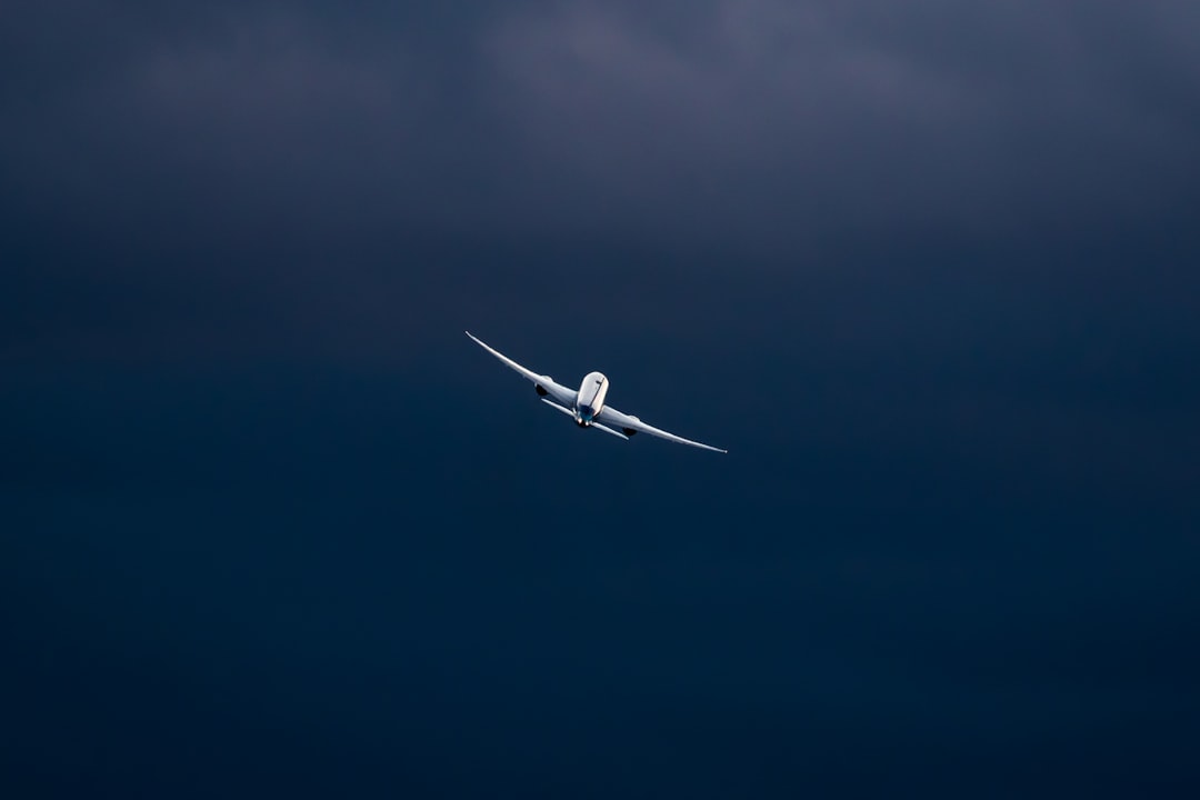 white-airplane-in-mid-air-during-daytime-ooch3kilqfe