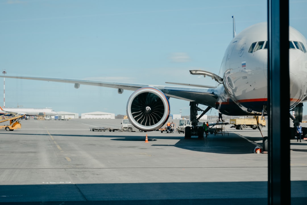 white-airliner-on-runway-tcp2k2sypfg